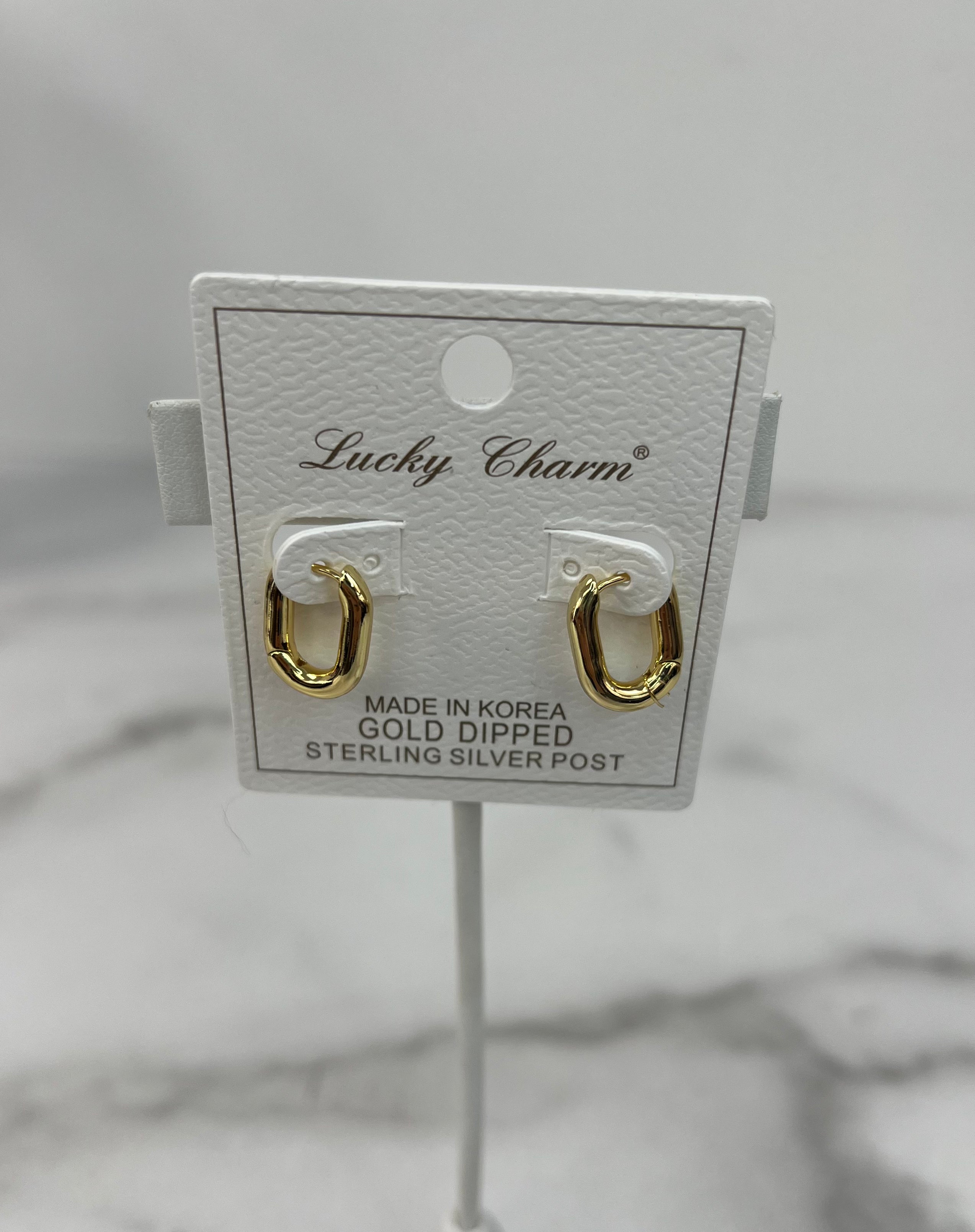 Gold-Dipped Oval Huggie Earrings